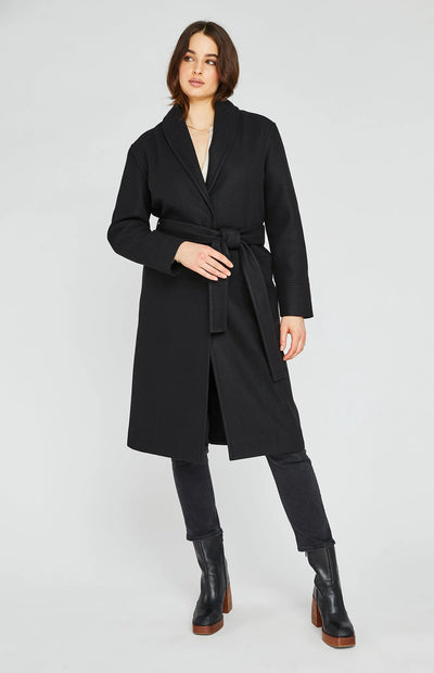 A woman wearing a black winter coat.